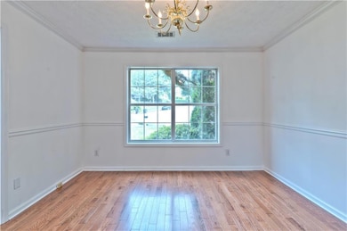 Spare room featuring a textured ceiling, a notable
