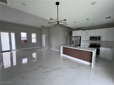Kitchen featuring stainless steel appliances, mode