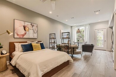 Bedroom with light wood-style floors, access to o