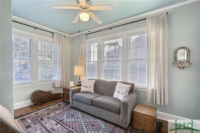 Sunroom or office off of living room.