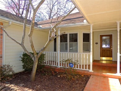 Beautiful Redbud tree in Spring.  House close to H