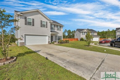 Two car garage and room to have a few cars in the