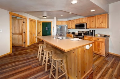 Kitchen with stainless steel appliances and open t