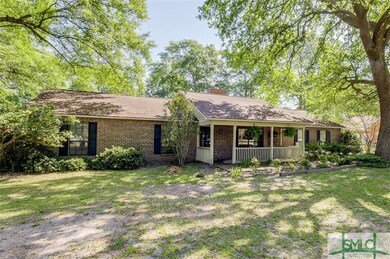 Exterior Front yard with lots of trees & the home 