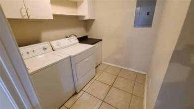 Washroom with washer and clothes dryer, electric 