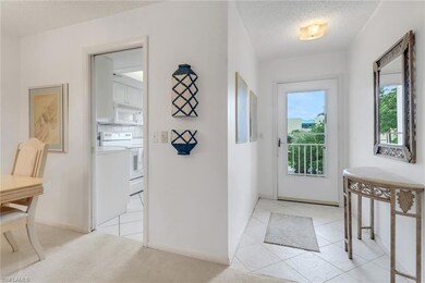 Foyer featuring a textured ceiling and light tile patterned floors