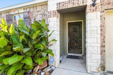 Entrance to property featuring stone siding