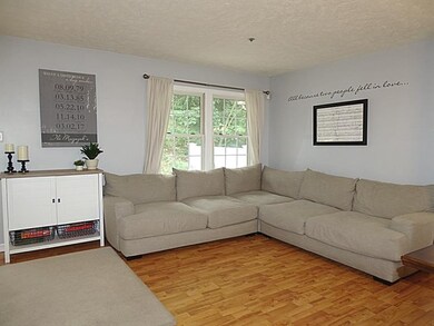 Spacious & bright living room open to the dining room...