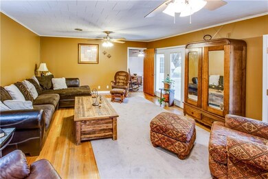 Living Room - Wood floors; two ceiling fans; 2 set