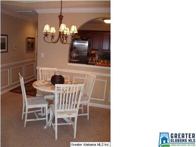 Notice the archway between the kitchen and living 