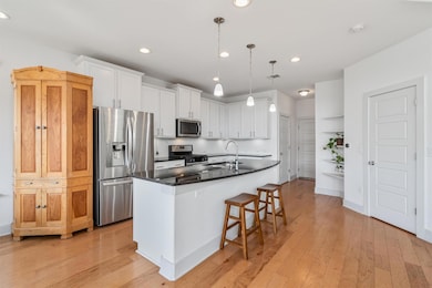 Kitchen featuring stainless steel appliances, whi