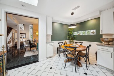 Adjacent to the kitchen, a cozy breakfast nook off