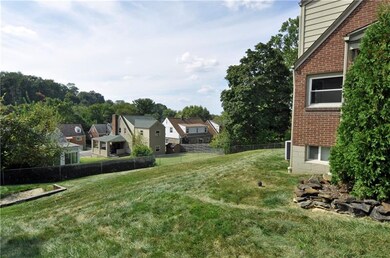 The fenced in yard has a gradual slope, but ideal 