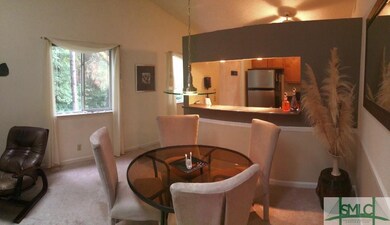 The Dining Area looking back into the Kitchen has 