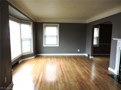 Living room with wood-type flooring