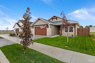 Craftsman house with board and batten siding, a standing seam roof, a metal roof, driveway, and a garage