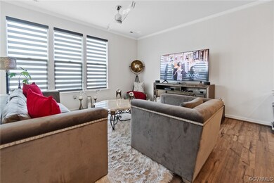 Living room with plenty of natural light, crown mo