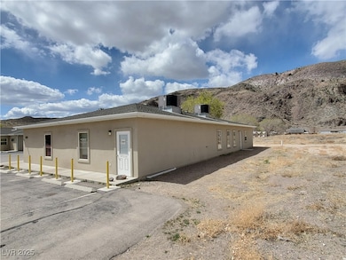 View of side of property featuring stucco siding a