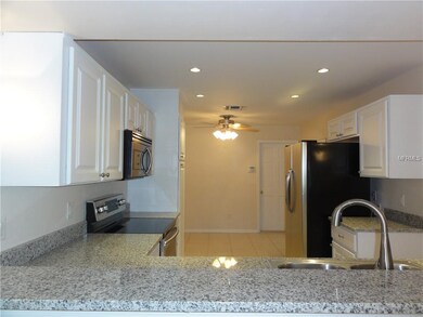 Kitchen with updated cabinets & granite counter to