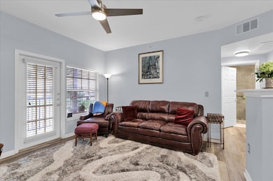 Living room with light wood finished floors and a