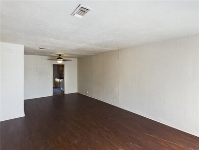 Spare room featuring wood finished floors and ceil
