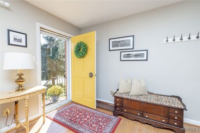 Elegant entryway with hardwood flooring & ample sp