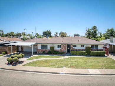 Great curb appeal with covered carport area and drive-thru garage.