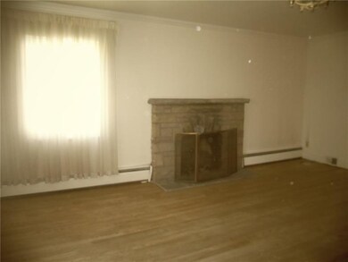 Living Room, featuring hardwoods and crown molding