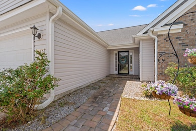 Property entrance featuring an attached garage and