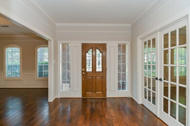 Entry way--hardwood floors extend into the dining room and study. Note the Plantation shutters!