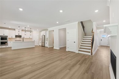 Unfurnished living room with crown molding, stairs, recessed lighting, and light wood-style floors