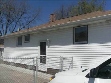 Exterior Front. Side view and entrance. The lot is