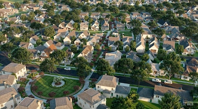 Aerial overview of property's location featuring nearby suburban area