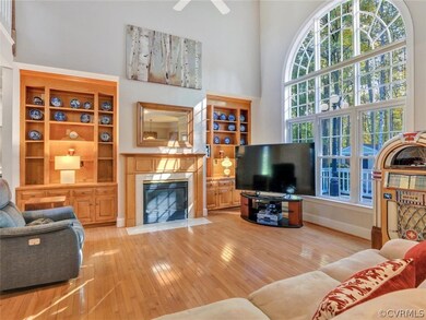 Two story family room with gorgeous palladian wind