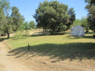 Looking out to Carter creek Road.  The well/pump s