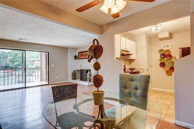 Cozy eat in area with updated ceiling fan and warm flooring.