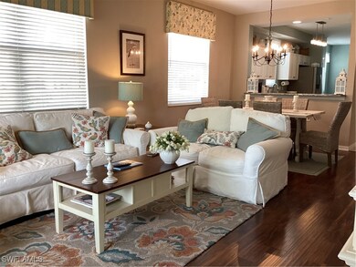 Living room with dark hardwood / wood-style floors