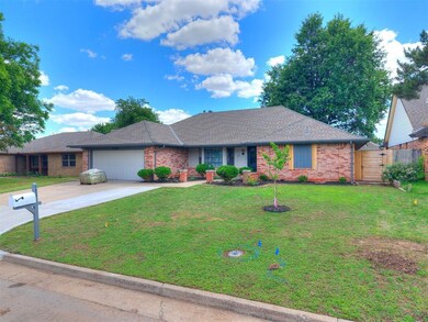 Single story home with a garage, brick siding, driveway, and roof with shingles