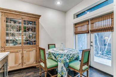 Dining area with dark hardwood / wood-style floors