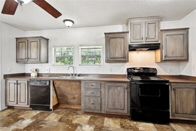 WELL APPOINTED KITCHEN INCLUDES REFRIGERATOR, DISH