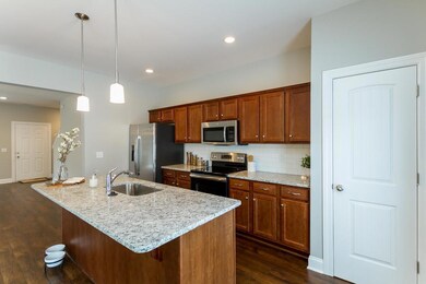 Kitchen with Granite, No Tile Backsplash. Full Stainless Steel Appliance Package