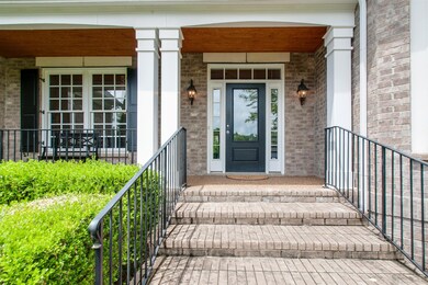 The welcoming front porch  has room to sit and enjoy a nice quiet evening. 