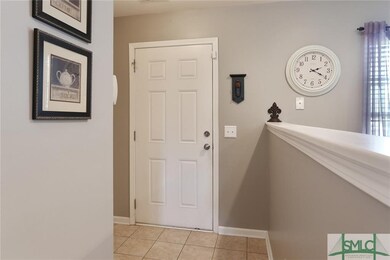 Foyer with coat closet & garage access