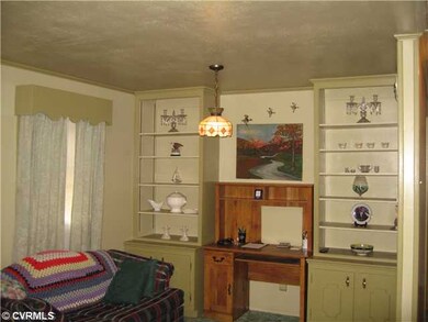 Living Room - Carpet, built-in shelving, office ar