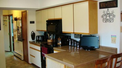Well lit Galley Kitchen has a...