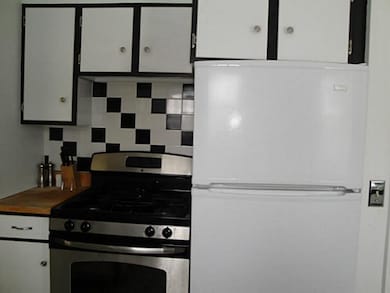 Kitchen. Nice tile backsplash enhances the kitchen