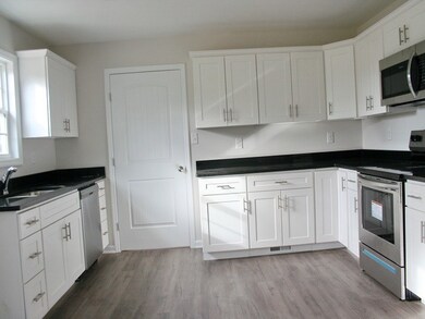 13x16 spacious kitchen with black granite.