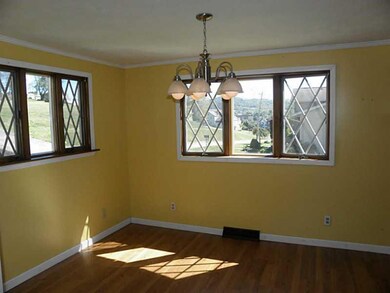 Dining Room. Beautiful Wood Floors & Bay Window in