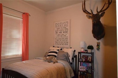 Bedroom featuring ornamental molding