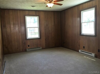 Cozy Family Room with new carpet and Ceiling Fan